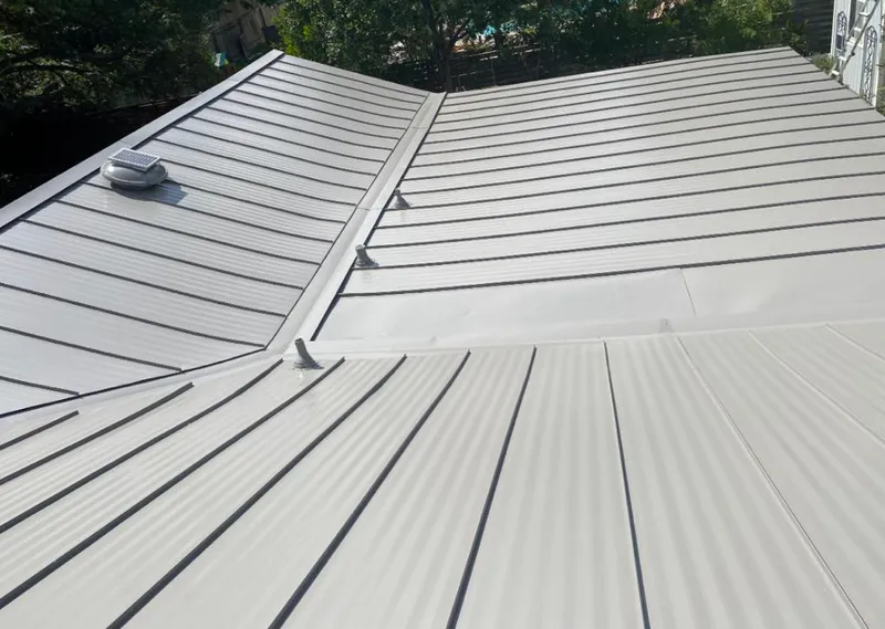 Solar attic fan installed on a metal roof for Roof Ventilation in Wimauma